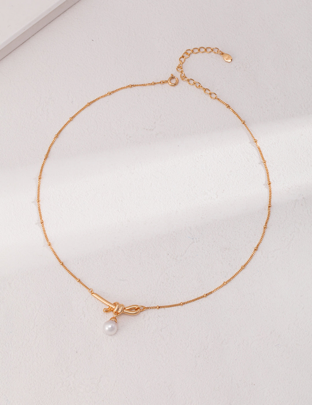 Topo Revive Golden Knot Pearl Necklace